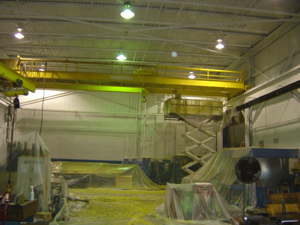 Bridge crane being painted after ceiling and walls