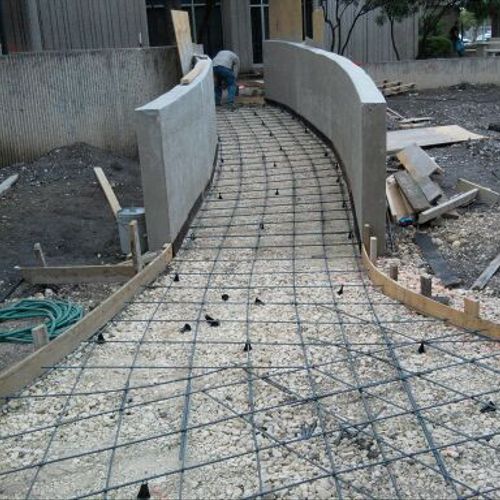 concrete walls and ramps and sidewalks for a local