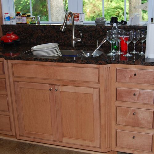 Cherry kitchen sink area cabinet..raised panel doo