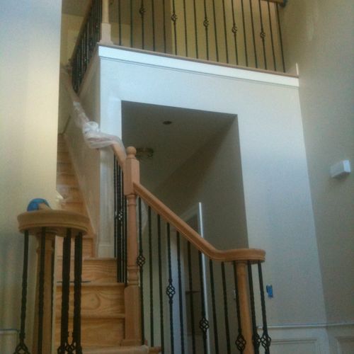 Oak hand rail and posts with cast iron balusters