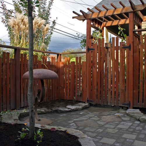 Fence, gate with arbor paver walk way, paver patio