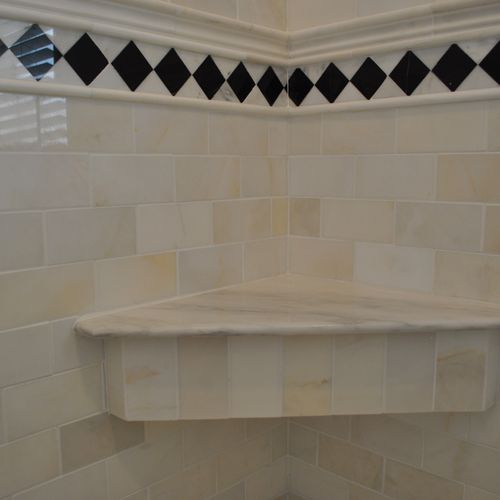 Angled seat for shower in tile.