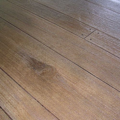 Knot in the middle of a Wood Finish floor.