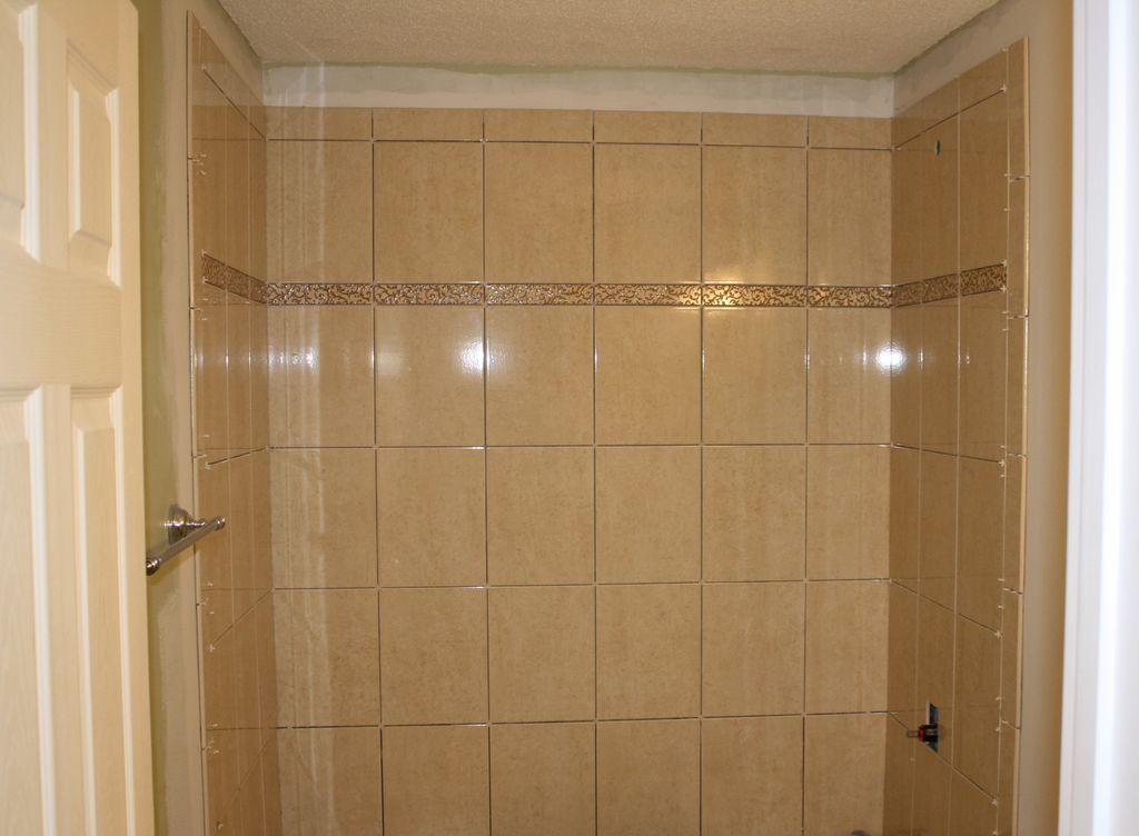 Tile tub surround prior to application of grout.