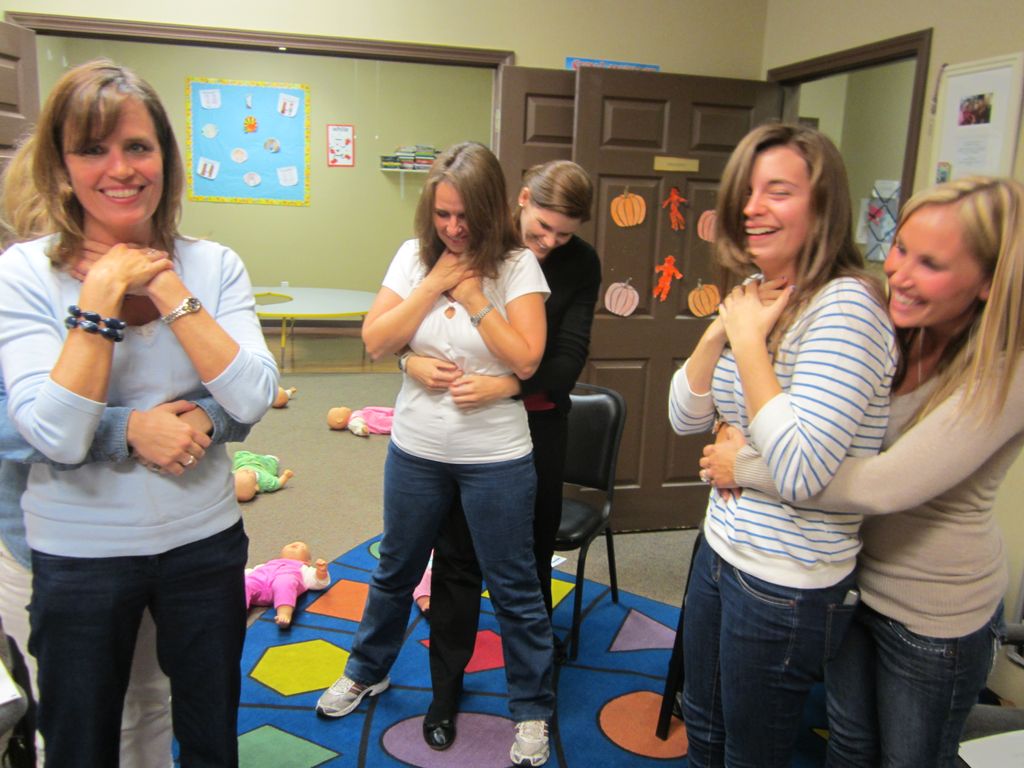 Practicing how to help a choking victim.