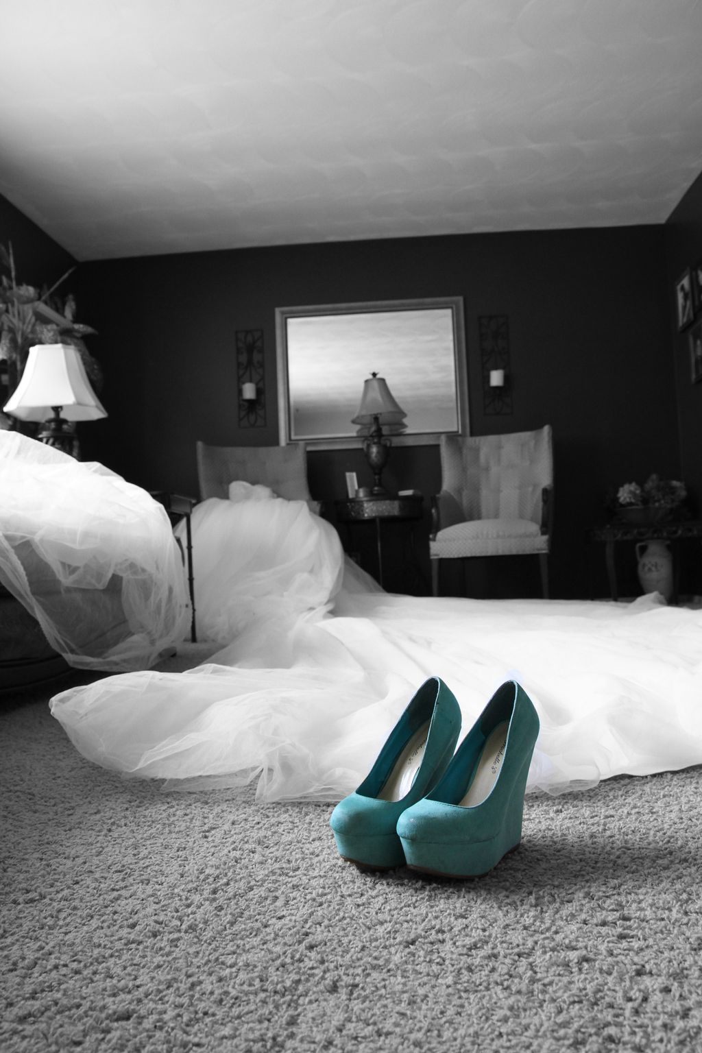 Bridal dress and shoes as she is getting ready.