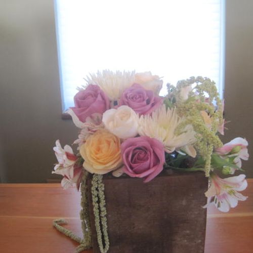 Table arrangements with lavender, pink, yellow and