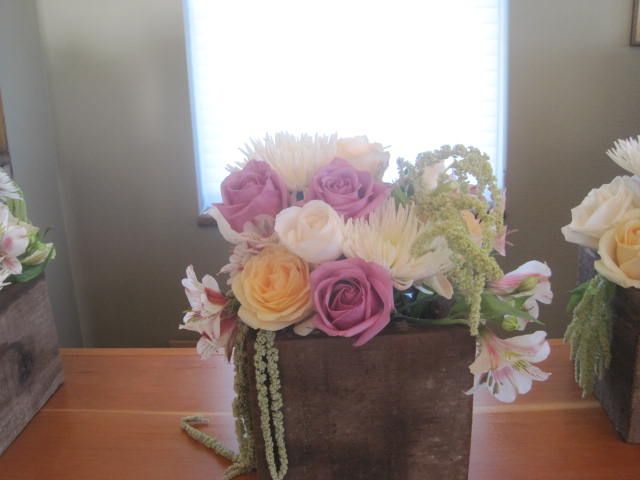 Table arrangements with lavender, pink, yellow and