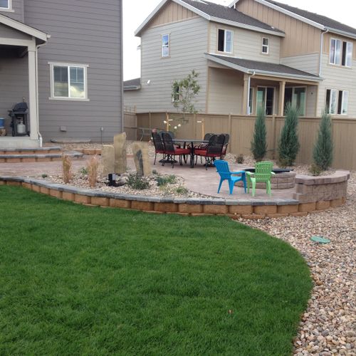 Full patio with water feature and fire pit
