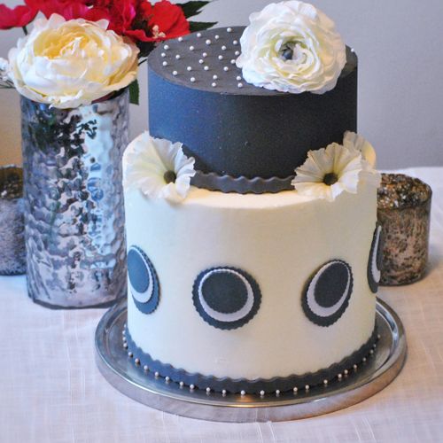 Modern gray and white birthday cake frosted with S