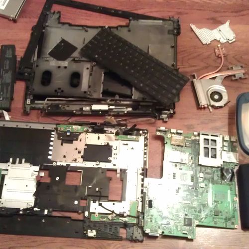 Dissembled laptop that needed video repair.