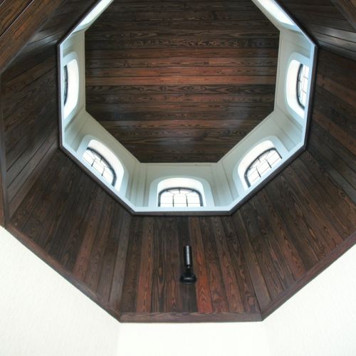A tongue and groove ceiling installed in a cupola.
