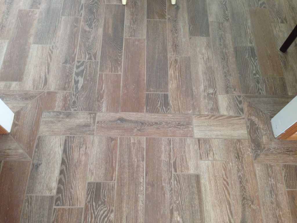 Beautiful, wood-look tile floor installed in Dinin