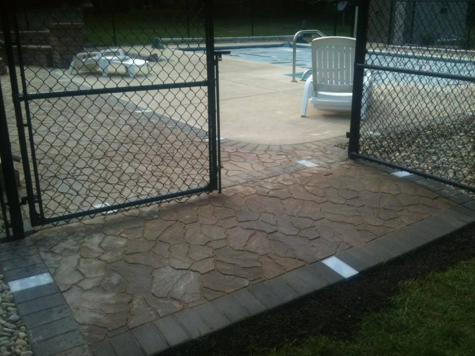 Gateway to outdoor living space with black metal f