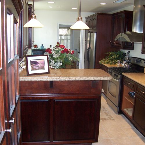 This is a Cherry wood Galley Kitchen