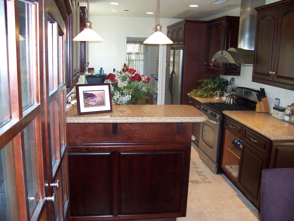 This is a Cherry wood Galley Kitchen