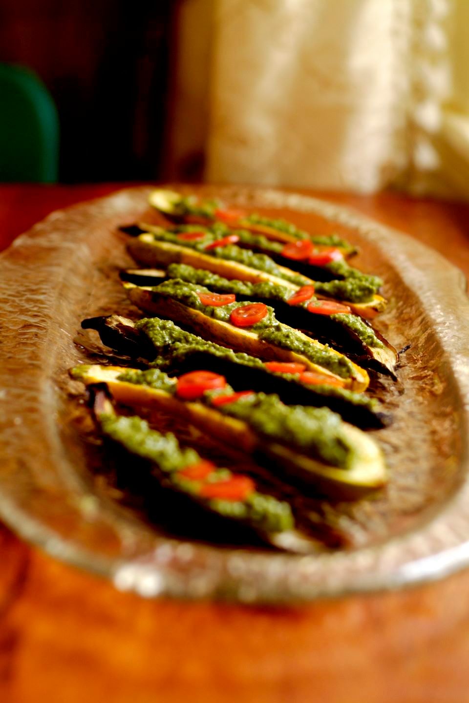 Mustard green and arugula pistou on roasted eggpla