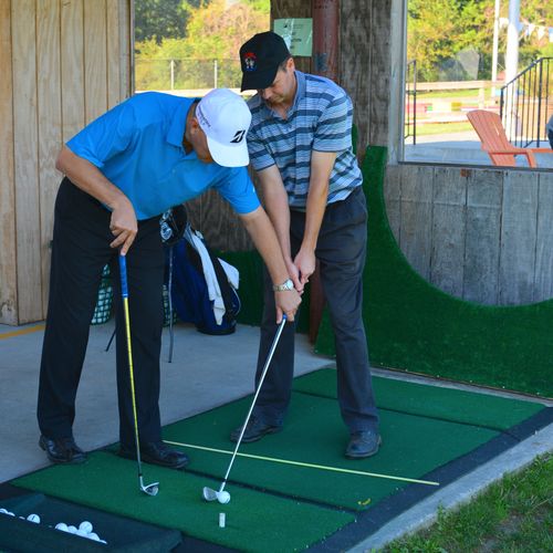 Golf Lesson in one of our 55 private hitting stall
