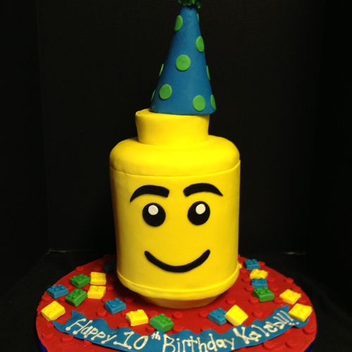 3D lego head cake with a modeling chocolate party 