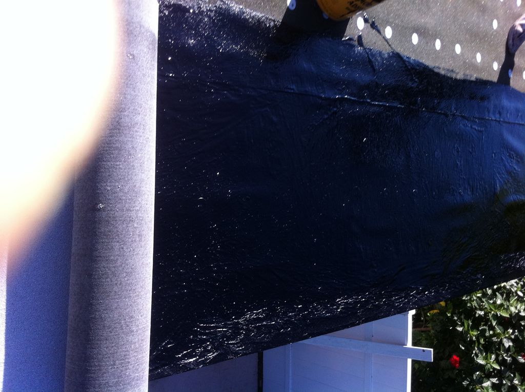 FLAT ROOF MOP IN PROGRESS WITH  GRANULATED WHITE M
