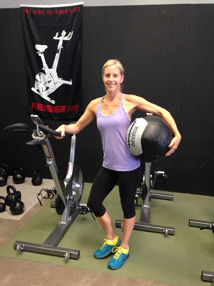 Christina working the weights and bike