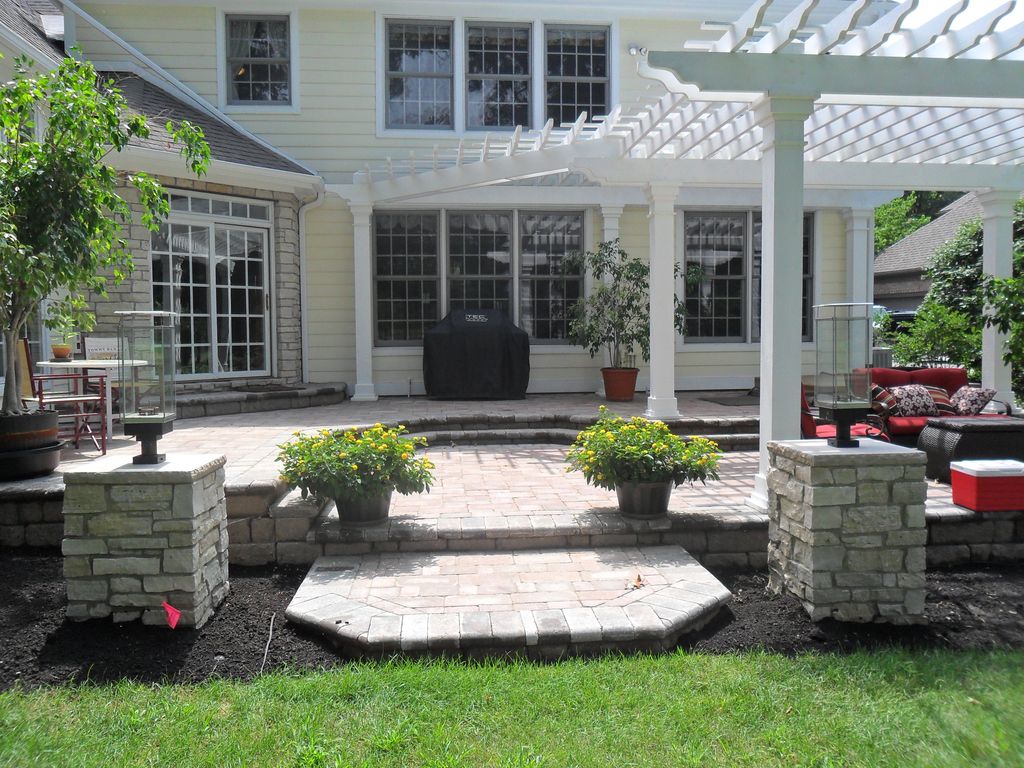 Raised multi level brick pavers patio, stone pilla