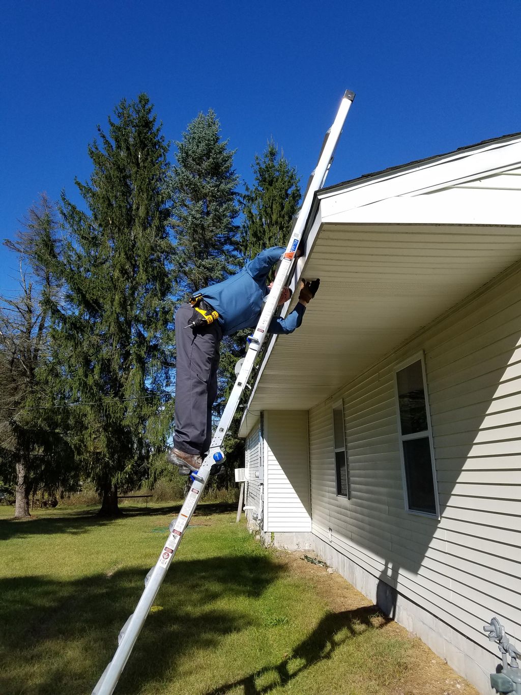 Huron Inspections, LLC inspecting soffits.