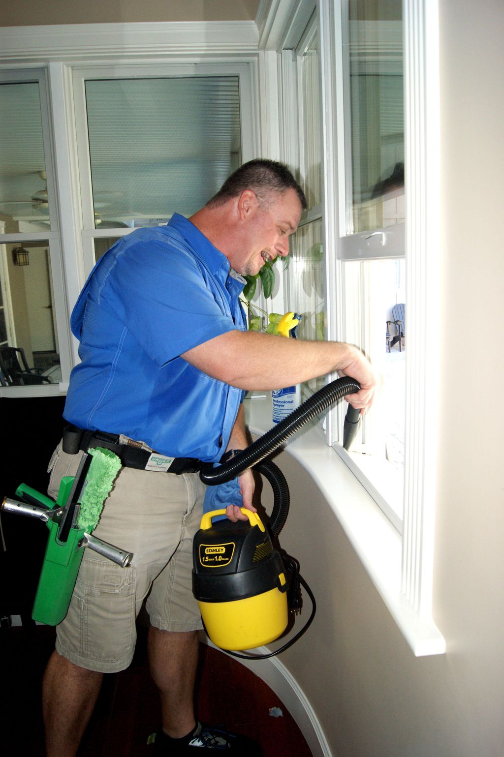 Vacuuming window tracks.