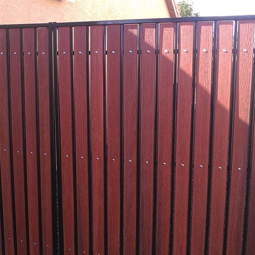 RV wrought iron gate refinished with composite woo