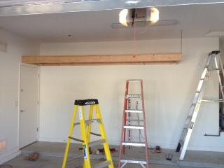 Addition of a 13 foot shelf in a garage. Notice...