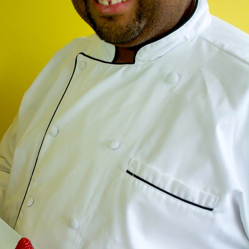 Chef Wendell holding one of our signature desserts