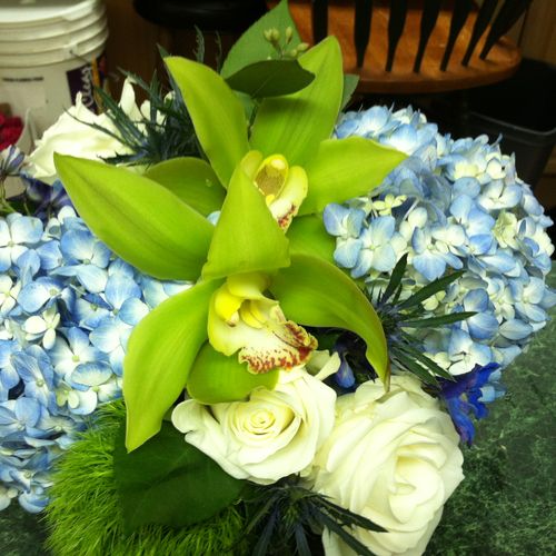 Blue hydrangea and green orchid centerpiece
