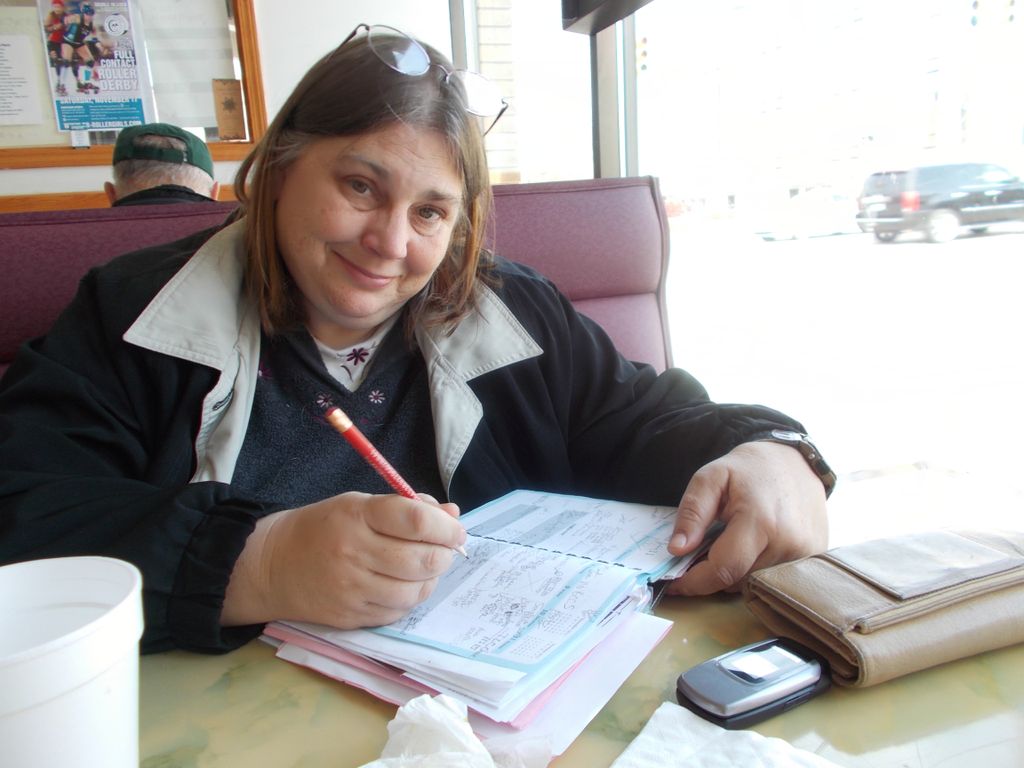 Karen working on planning some upcoming musical ad