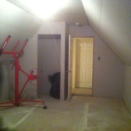Drywall installation in Bonus Room.