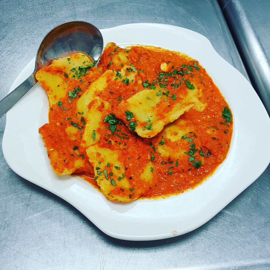 Mexican ravioli with roasted red pepper sauce