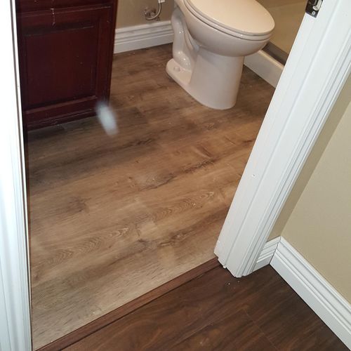 Vinyl plank flooring and new toilet install.