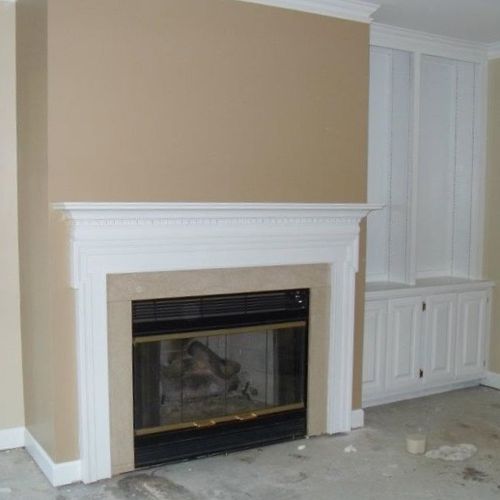 After pictures of fireplace, bookcases and walls.