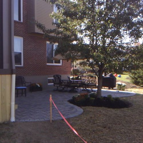 Distant photo of paver patio installed by Frisby C