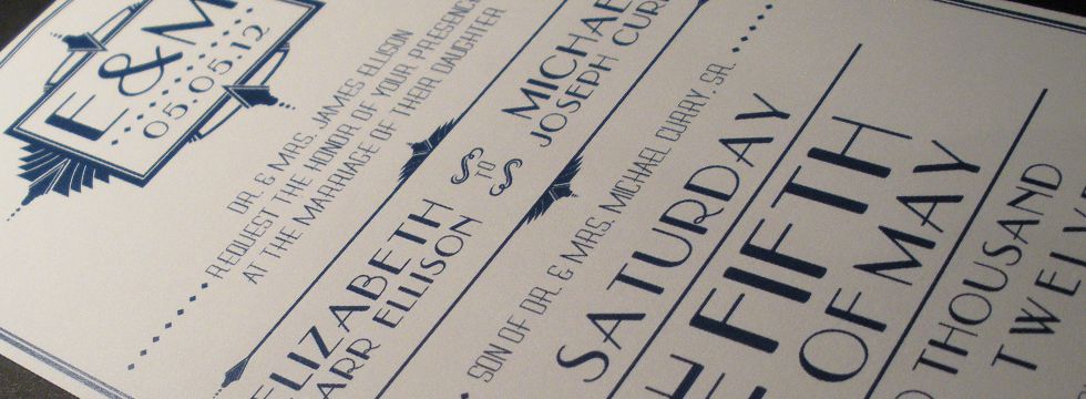Close up of art deco wedding invitation.