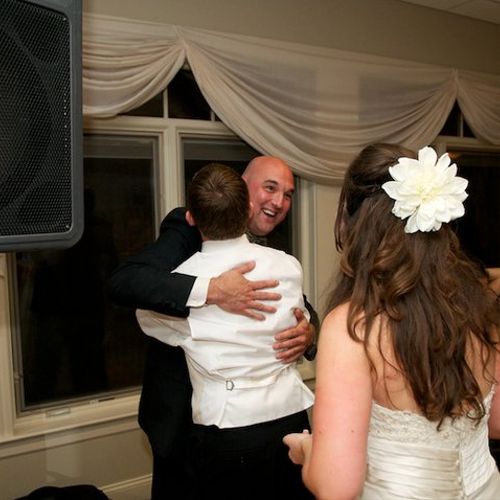 A hug from a groom means a job well done.  this we