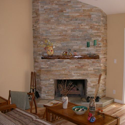 Newly refaced fireplace. Originally, red brick wit
