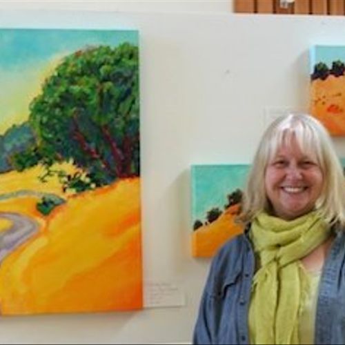 Karen Lynn Ingalls with some of her paintings