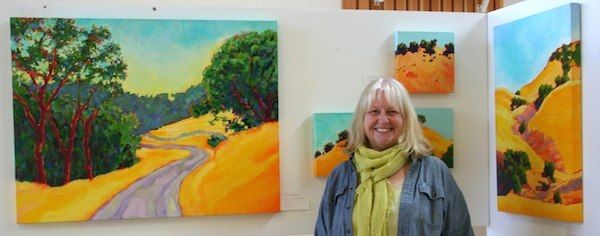 Karen Lynn Ingalls with some of her paintings