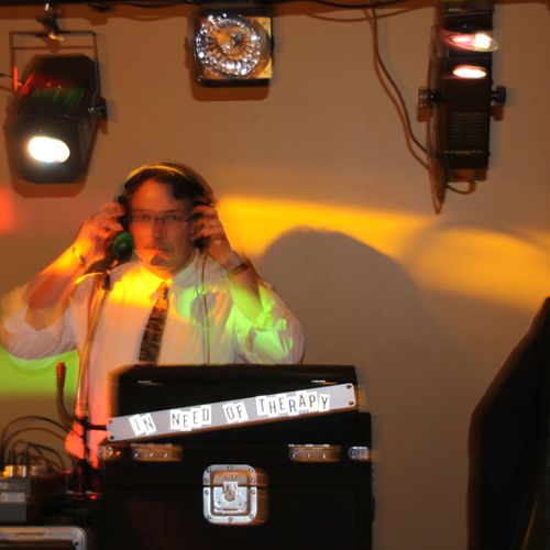 DJ Ric spinning tunes at a wedding reception.