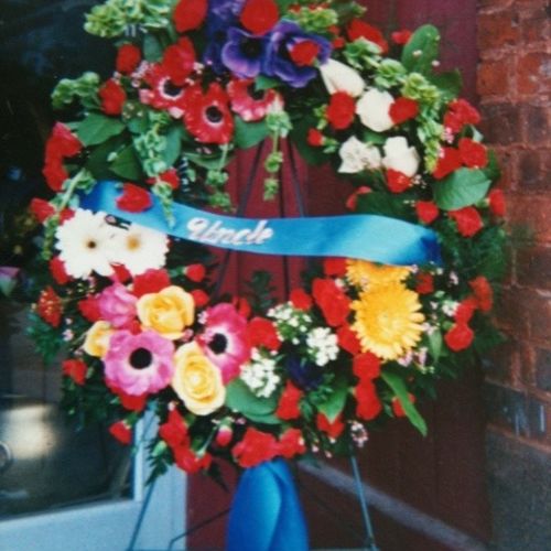 Large colorful flowers funeral wreath, including s