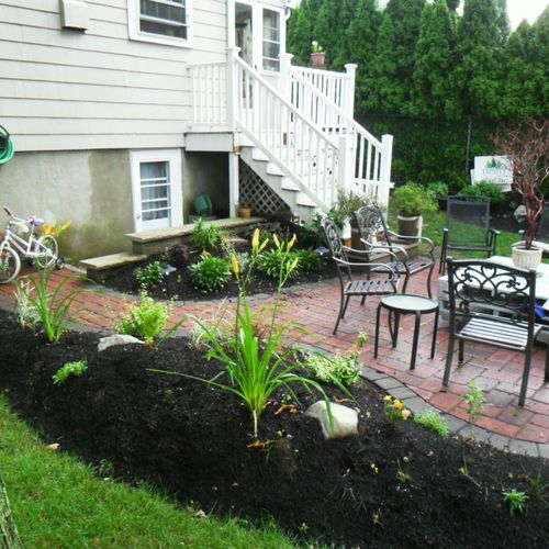 We built this patio and added berms with plantings