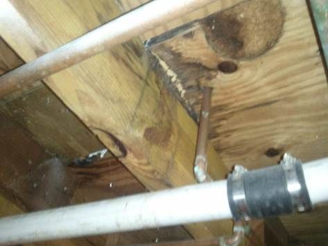 Water leak detected under upstairs bathroom.