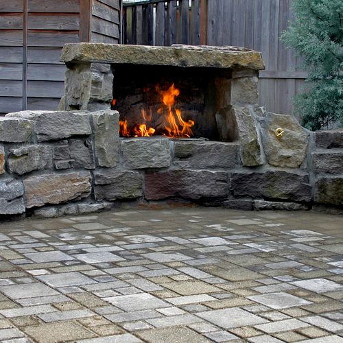 Natural Stone gas fireplace with paver patio