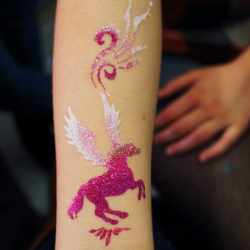 Glitter tattoos using stencils and freehand applic