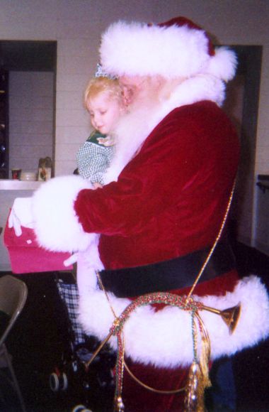 Santa at a family Christmas reunion with a good gi